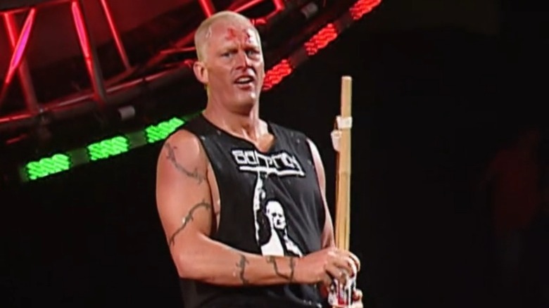 The Sandman opening a beer