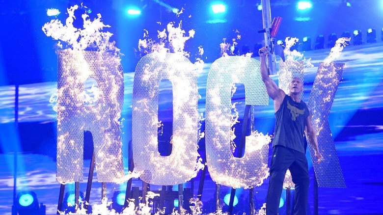 Rock setting a sign on fire
