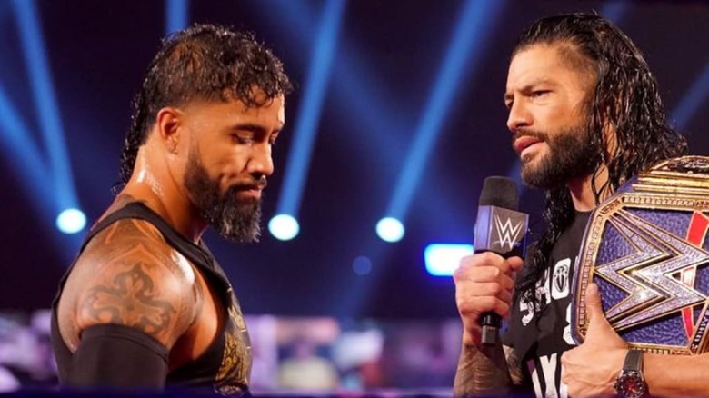 Roman talking to Jey