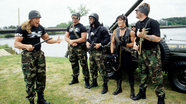 Triple H speaks to Billy Gunn, Shawn Waltman, Chyna, and Road Dogg ahead of their "invasion" of WCW.