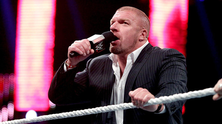 Triple H cuts a promo in front of a "WWE Raw" crowd during his storyline with The Authority in the early 2010s.
