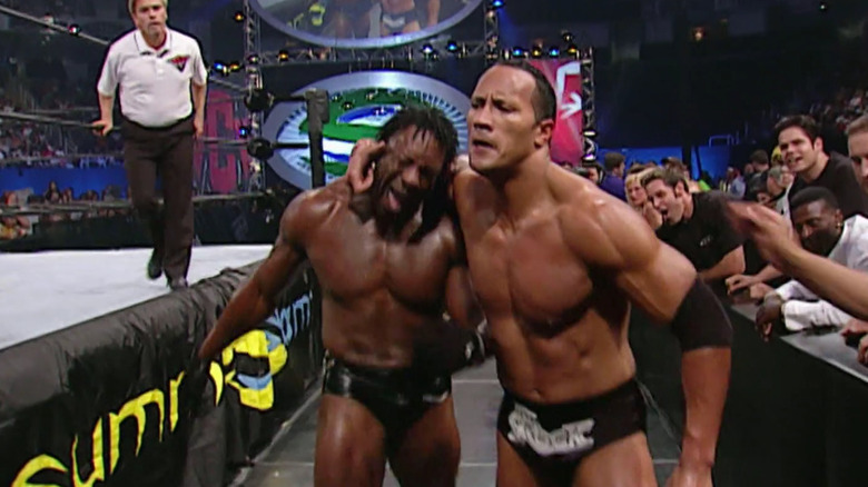 Booker T And The Rock Fight Outside Ring 