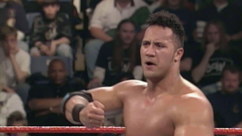 Young Rocky Maivia holds out fist