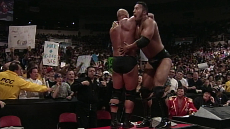 The Rock About To Put Steve Austin Through Table 