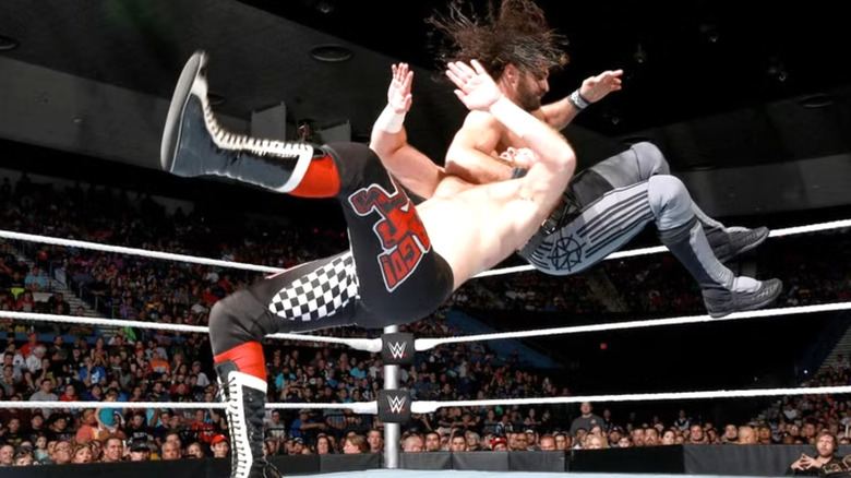 Seth Rollins hits a sling blade to Sami Zayn