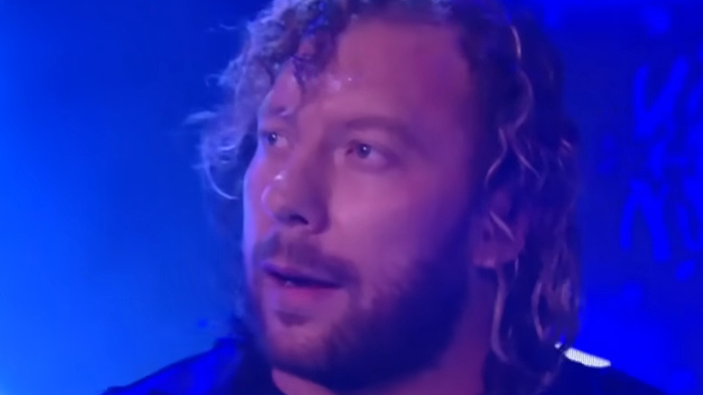 Kenny Omega blue background