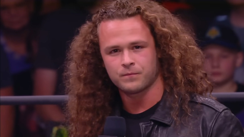 Jungle Boy in the ring cutting a promo