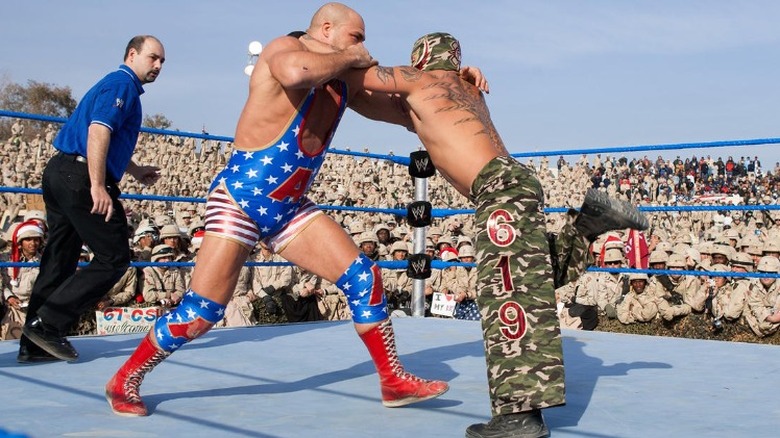 Kurt Angle locks up with Rey Mysterio