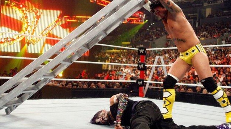CM Punk hits Jeff Hardy with a ladder