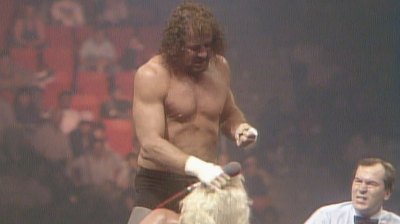 Funk batters Flair during their Clash IX match