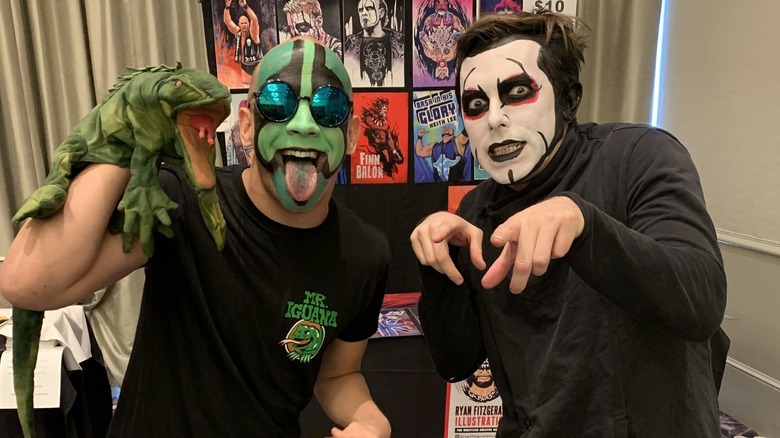 Mr. Iguana holding La Yesca next to Danhausen
