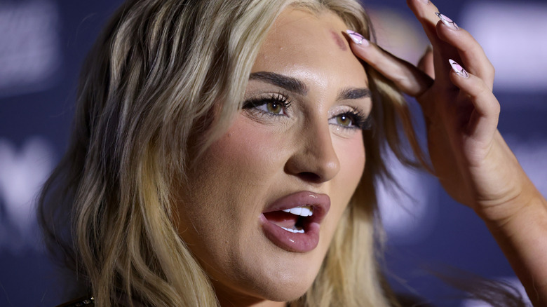 Tiffany Stratton touching her forehead