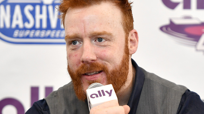 Sheamus on a microphone
