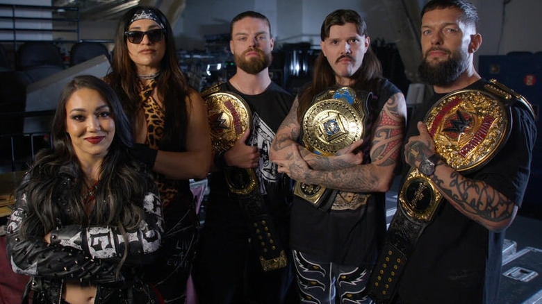 Judgment Day with their title belts