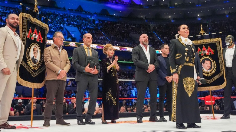 Representatives of WWE and AAA stand in the ring and welcome fans to Triplemania 33