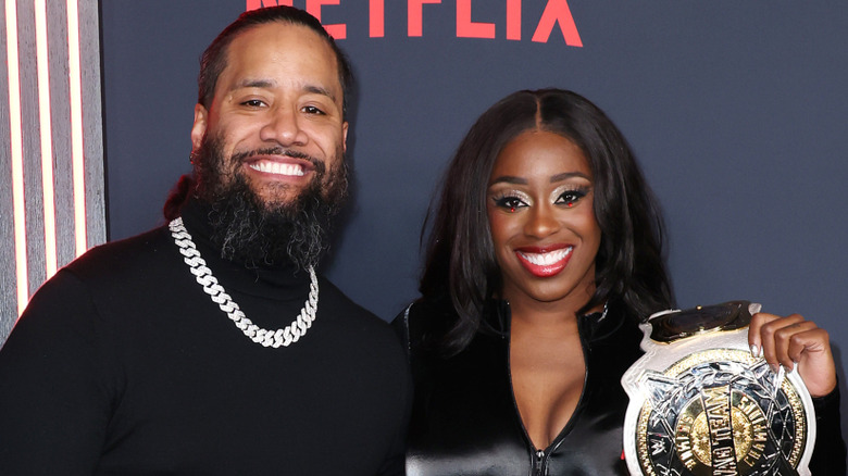 Jimmy Uso and Naomi posing at a media event
