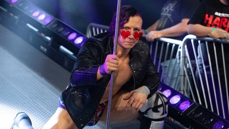 Ace Austin wearing heart glasses