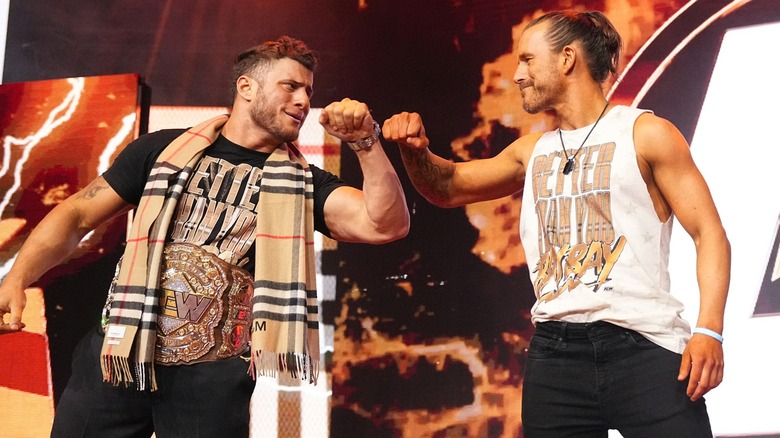 MJF and Adam Cole bump fists on their entrance