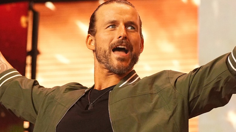 Adam Cole accepts the cheers of the crowd