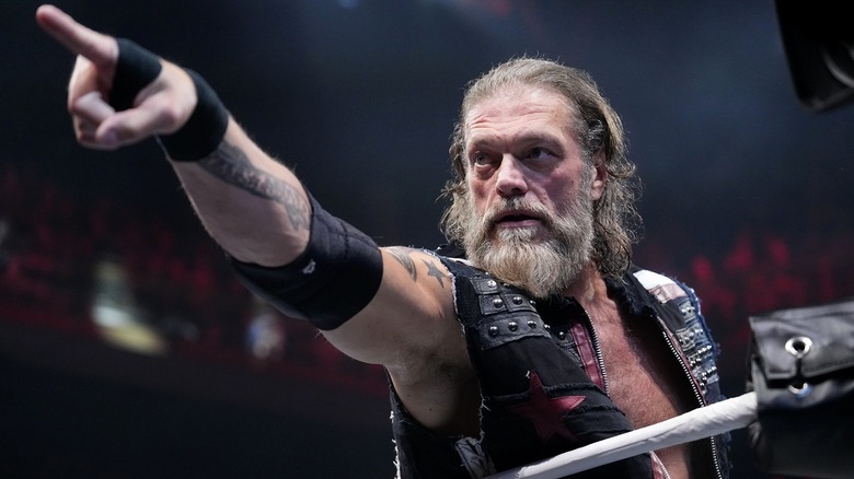 Adam Copeland pointing from inside of the ring ahead of a clash alongside Christian Cage against The Deathriders on an episode of 