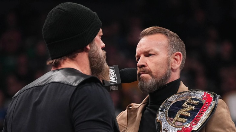 Christian Cage and the back of Adam Copeland's head