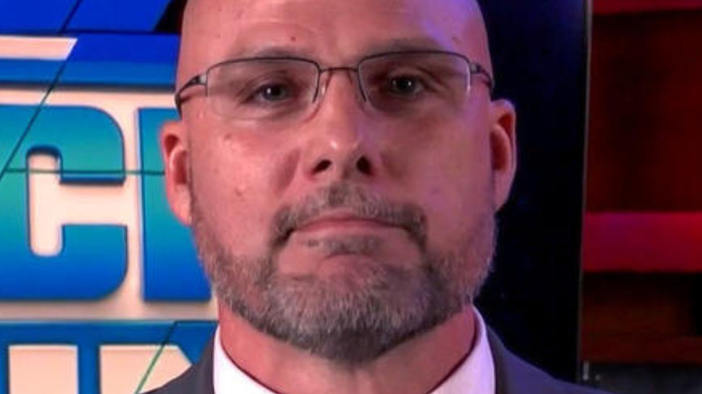 Adam Pearce wearing glasses