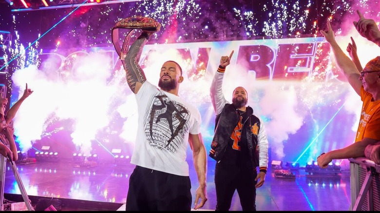 Roman Reigns (accompanied by Jimmy Uso) basks in the acknowledgement from the Tennessee crowd