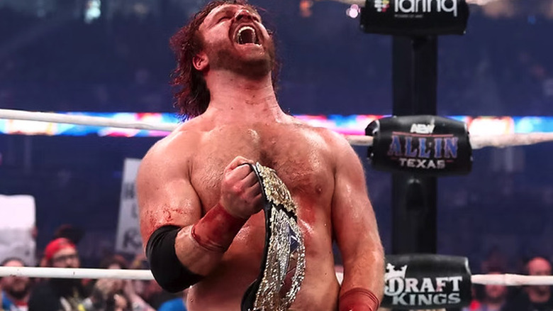 Hangman Page with the AEW world title