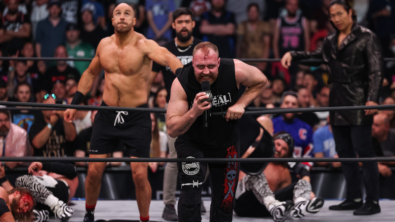 Jon Moxley grimaces into a microphone