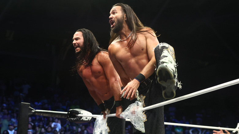 The Young Bucks stand on the ropes in the ring and yell to the stage and tron during a segment where their limo is destroyed on "AEW Dynamite."