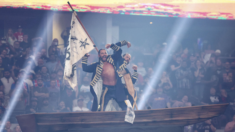 The Young Bucks hit their signature pose on top of a boat during their entrance at All In Texas.