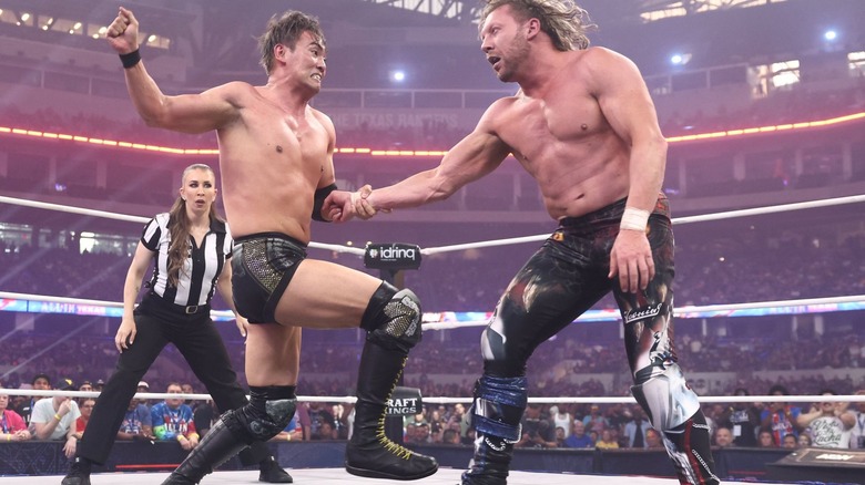Kazuchika Okada hits Kenny Omega with the Rainmaker