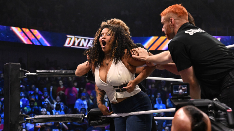 Security holds back AEW Women's World Champion Willow Nightingale on the ropes during a confrontation with Mercedes Mone during the August 19, 2026 edition of "AEW Dynamite."