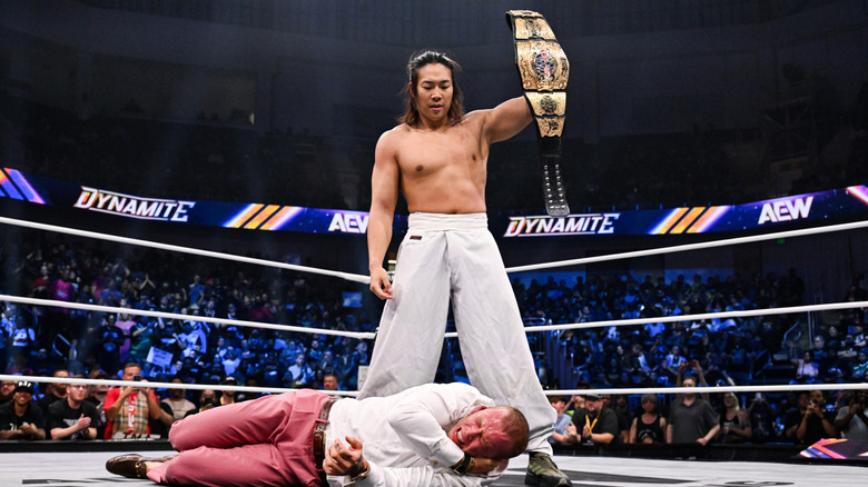 Konosuke Takeshita stands over a downed Kyle Fletcher, holding the AEW International Championship, in the ring during the August 19, 2026 edition of "AEW Dynamite."