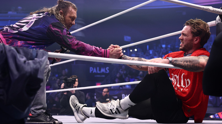 Kenny Omega and Will Ospreay clasp hands on the ring on "AEW Dynamite"