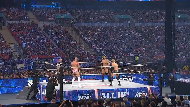 Kazuchika Okada, Konosuke Takeshita, and Kyle Fletcher face off in the ring