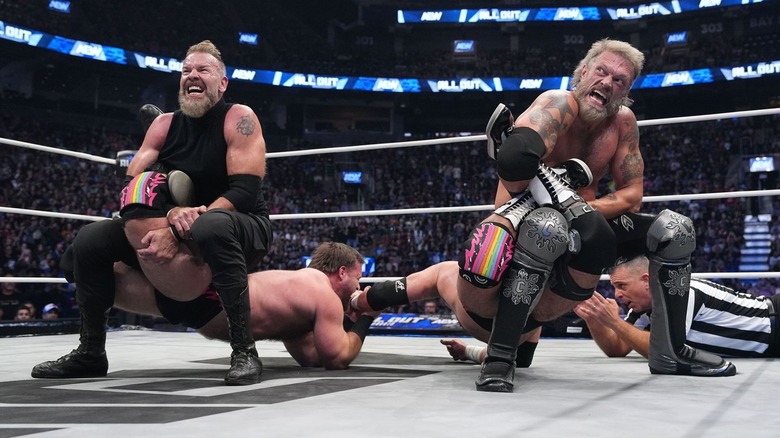 Adam Copeland and Christian Cage with double Sharpshooters on FTR at AEW All Out 2025