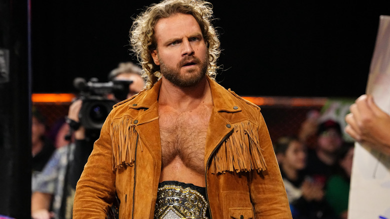 "Hangman" Adam Page heads to the ring, wearing the AEW World Championship around his waist, before a match on "AEW Dynamite."