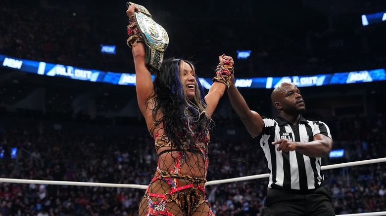 Mercedes Mone celebrates with her TBS Championship