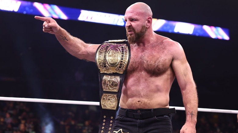 Jon Moxley pointing with the Continental title over his shoulder on "AEW Dynamite"