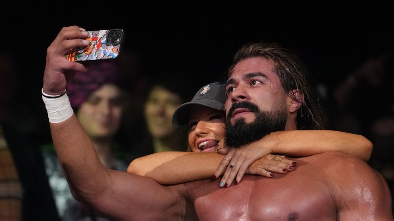 Andrade poses with a "fan" on Dynamite