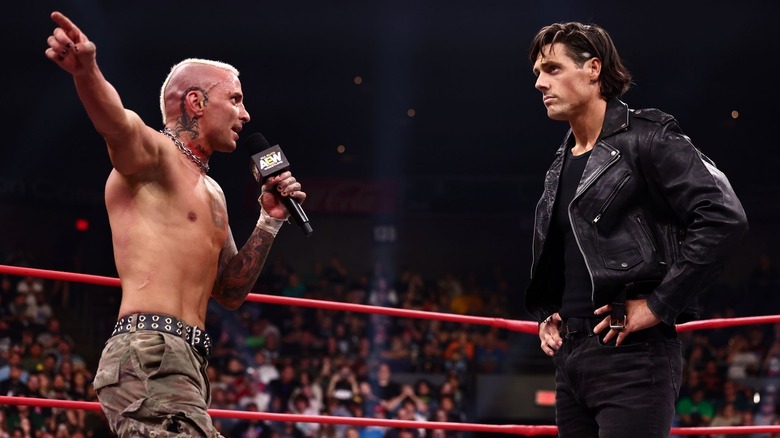 Darby Allin talking to Steven Borden through a microphone
