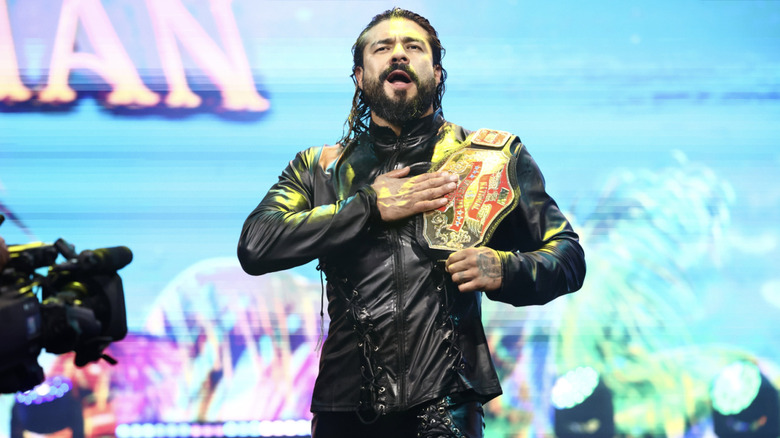 Andrade on the entrance ramp with his National Championship belt around his shoulder