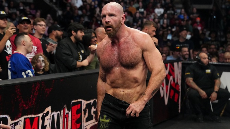 Jon Moxley walks around ringsde