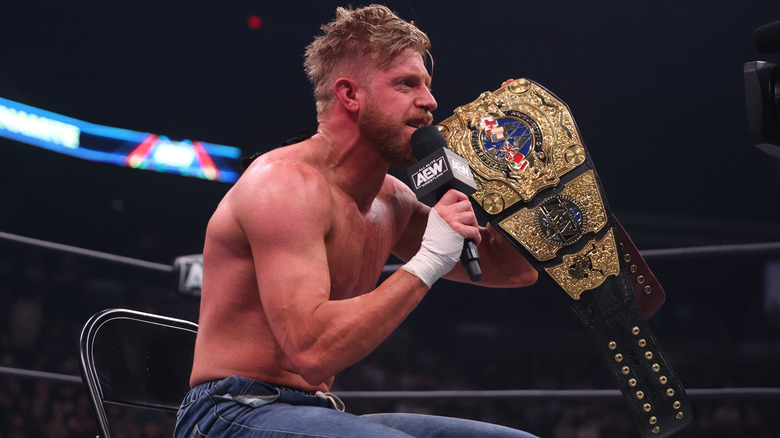 Orange Cassidy brandishes his title as he speaks