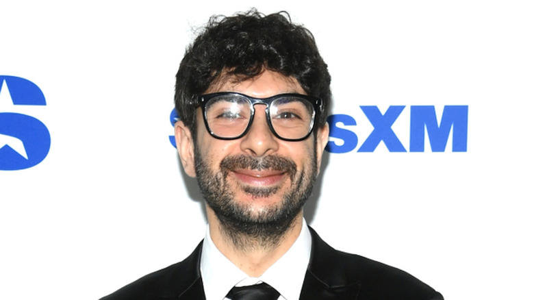 Tony Khan grinning at a SiriusXM event
