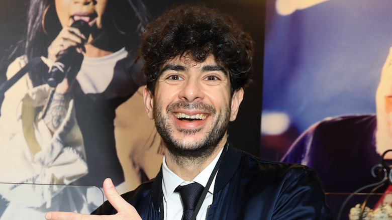 Tony Khan, smiling and pointing