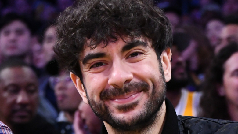 Tony Khan with an audience behind him