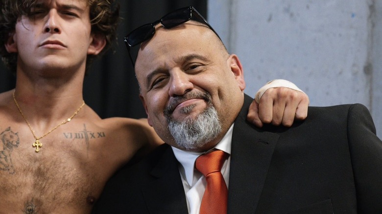 Taz posing backstage with his son Hook