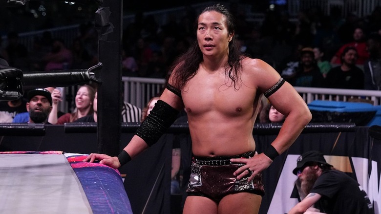 Konosuke Takeshita standing next to the ring